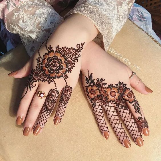 19. ​​Symmetrical Arabic Full Hand Mehndi Design