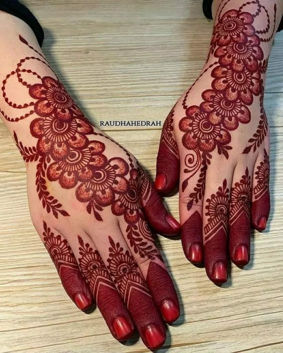 6. Elegant Full Hand Mehndi Design with Floral Patterns